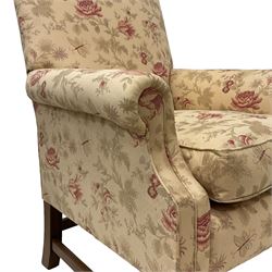 Peter Dudgeon - Georgian design mahogany framed armchair, shaped cresting rail over sprung back and seat flanked by rolled arms, upholstered in floral patterned fabric with matching seat cushion, on square supports joined by stretchers
Provenance: From the Estate of the late Dowager Lady St Oswald
