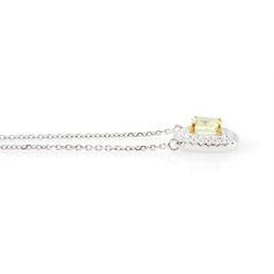18ct white gold diamond pendant necklace, single cushion cut fancy yellow diamond of 1.05 carat, surrounded by a double halo of round brilliant cut white diamonds, to a fine trace link chain necklace, hallmarked, total white diamond weight 0.26 carat 
