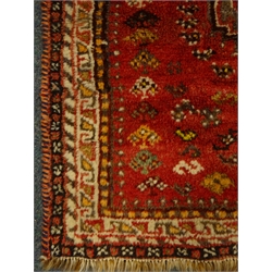  Persian red ground rug, two medallions, 143cm x 110cm  