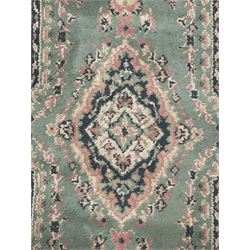 Pair of Bangladeshi olive ground runner rugs, machine-made with 100% jute pile, each with three central diamond-shaped medallions with intricate floral motifs, the field decorated with scrolling floral designs, bordered by stylised floral patterns 