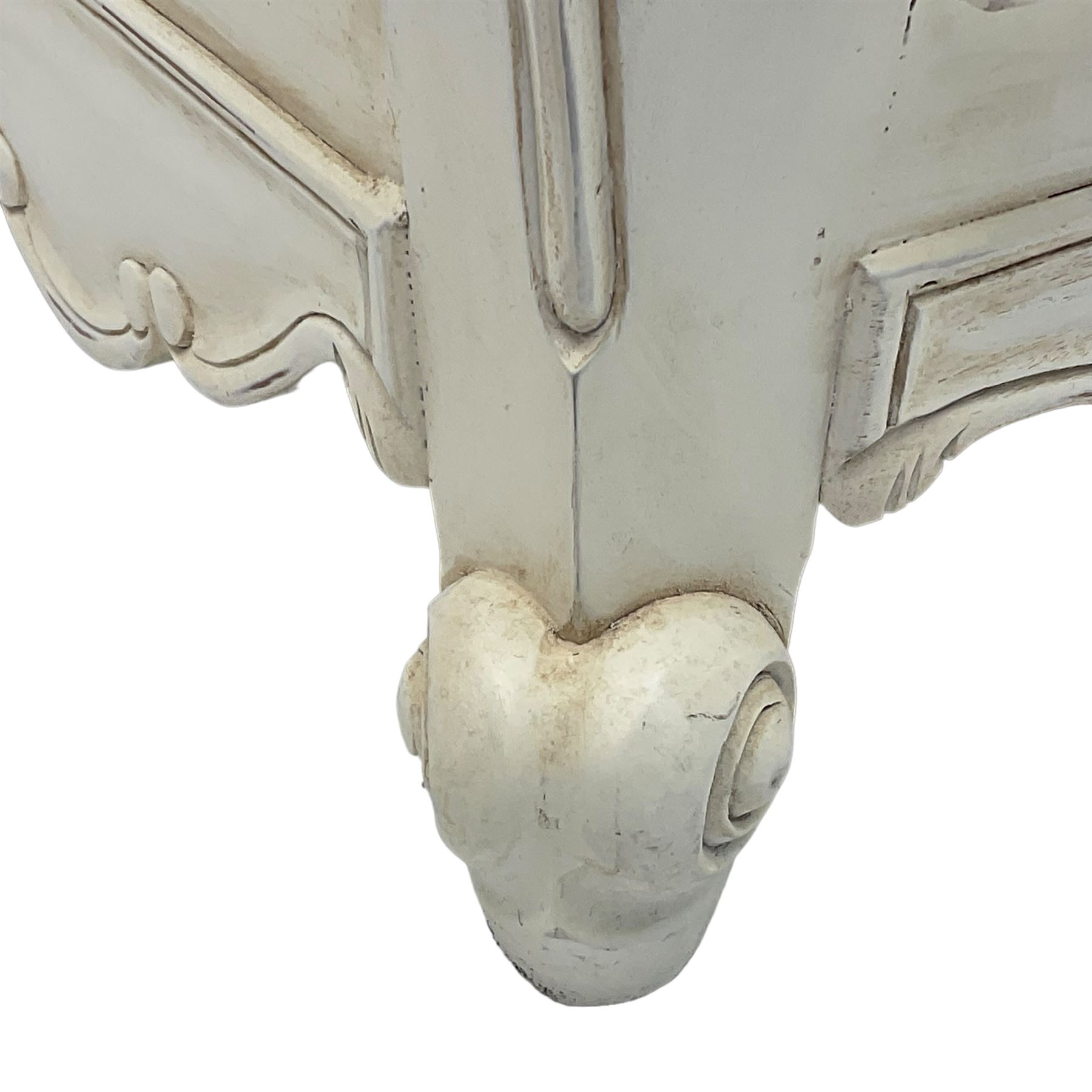 French design bombe shaped chest, moulded rectangular top over two short and three long drawers, on scrolled feet, in cream paint finish 