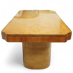 In the manner of Harry & Lou Epstein - Art Deco figured walnut veneered dining table, rectangular top with canted corners and glass protective top, edge with gently canted profile, on two rounded drum-shaped pedestals together with a set of four mid-century style walnut chairs, with elegant scroll and walnut veneered backs, upholstered in a light cream leather, 54x44x96cm