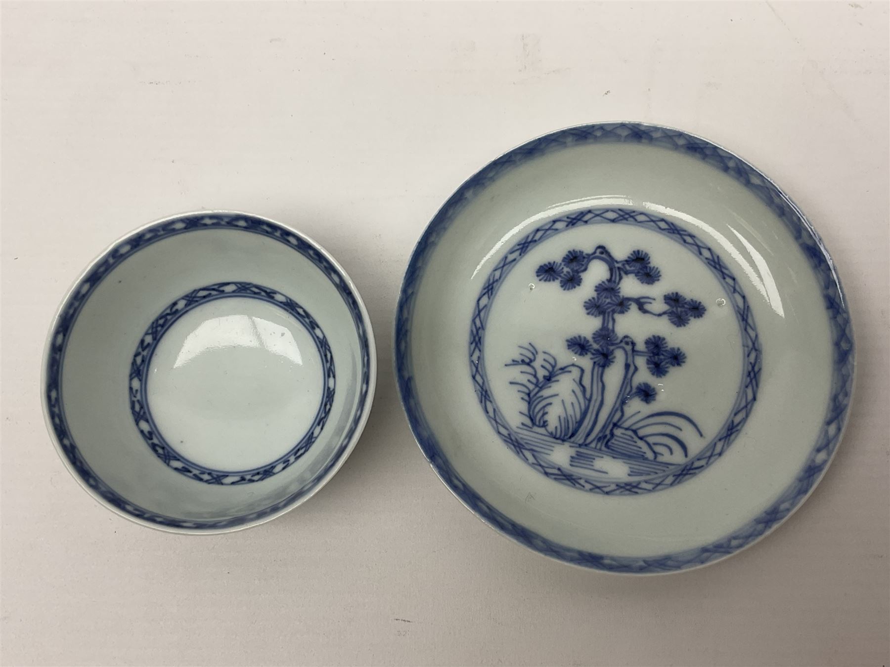 Chinese Nanking Cargo tea bowl and saucer, each decorated with pin tree, saucer with Christie's lot label beneath, tea bowl D7.5cm, saucer D11.5cm