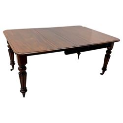 
Late Victorian mahogany extending dining table and four chairs, rectangular top with rounded corners and moulded edge, fitted with two additional leaves, raised on turned and reeded legs with brass castors, with a pair of Victorian mahogany hall chair, with curved top rail and plain splat, padded seat in textured salmon pink fabric, raised on turned and tapering front legs and another pair of early 20th century mahogany dining chair, with shield back and carved pierced splat, serpentine seat rail with striped upholstered cushion, raised on moulded square front legs