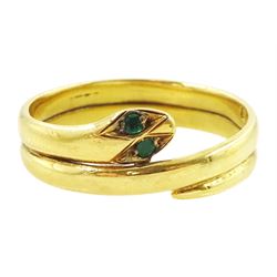 Early 20th century 18ct gold coiled snake ring, with green stone set eyes