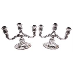Pair of 20th century German silver three light twin branch candelabra, with wrythen twist detail throughout, each with crown and crescent mark, stamped 835 and bearing mark for Bruckmann & Sohne, Heilbronn, H21cm W25cm