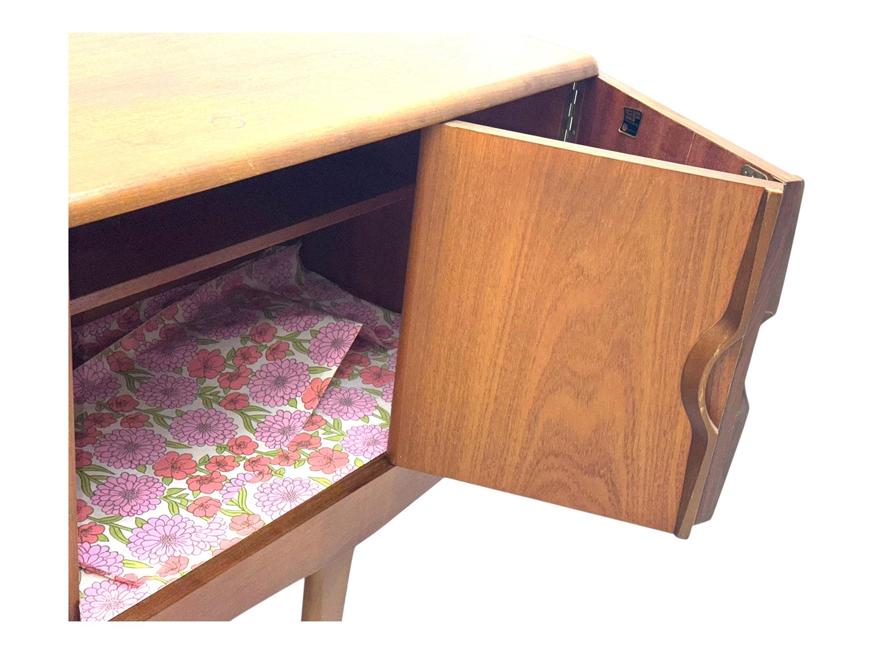 Stonehill - mid-20th century teak sideboard, three central drawers flanked by concertina cupboard doors, on tapering supports