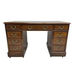 Georgian design oak twin pedestal desk, fitted with nine drawers