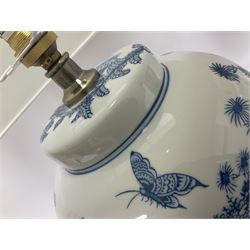 Pair of Chinese table lamps of baluster form, each decorated with landscape scene, raised upon gilt circular base, including shade H63cm