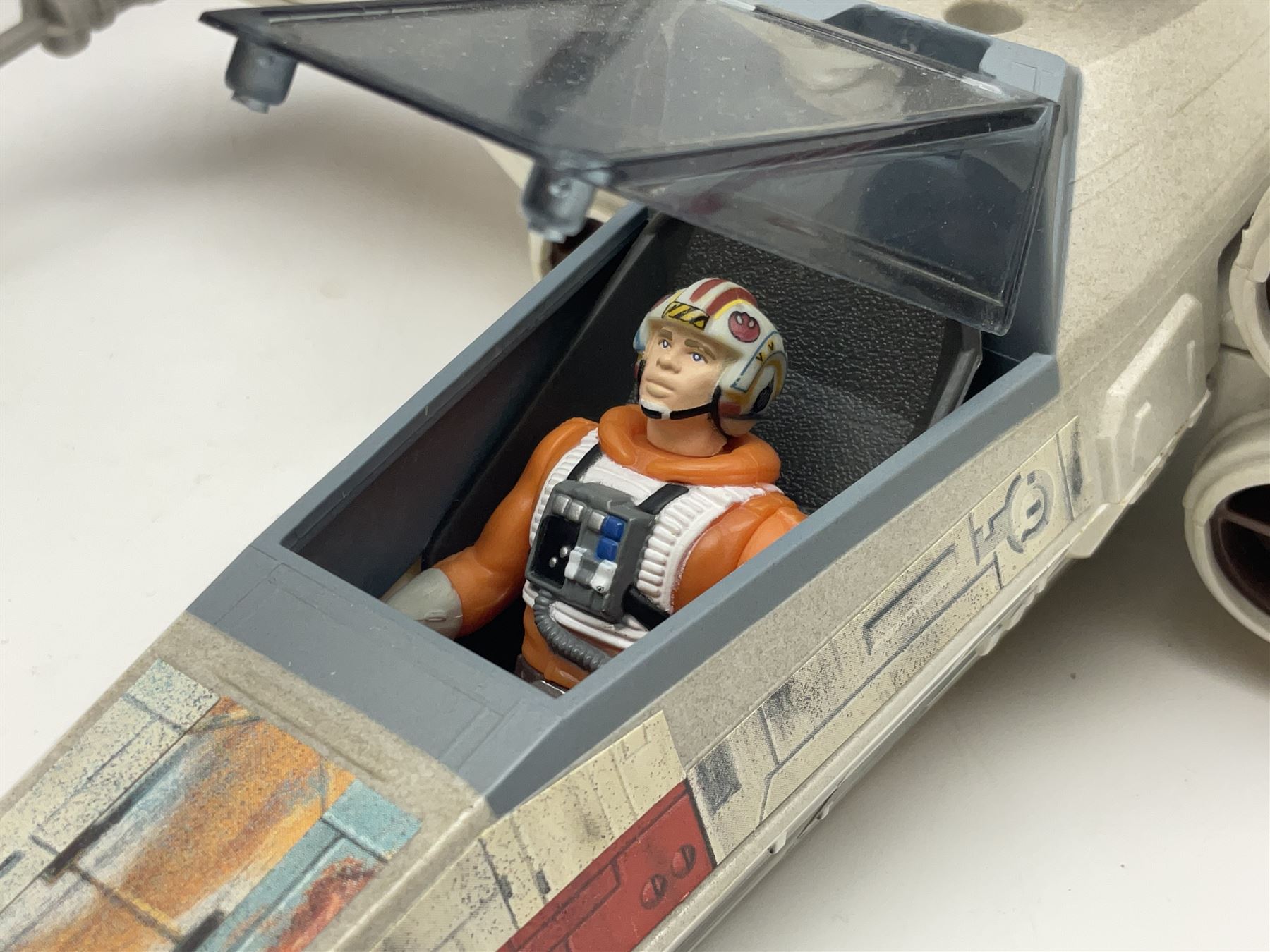 Star Wars - four space/land vehicles comprising Millenium Falcon with hinged top and figures; TIE Fighter; X-Wing Fighter with pilot; and AT-ST 'Chicken Walker' transporter; all unboxed (4)