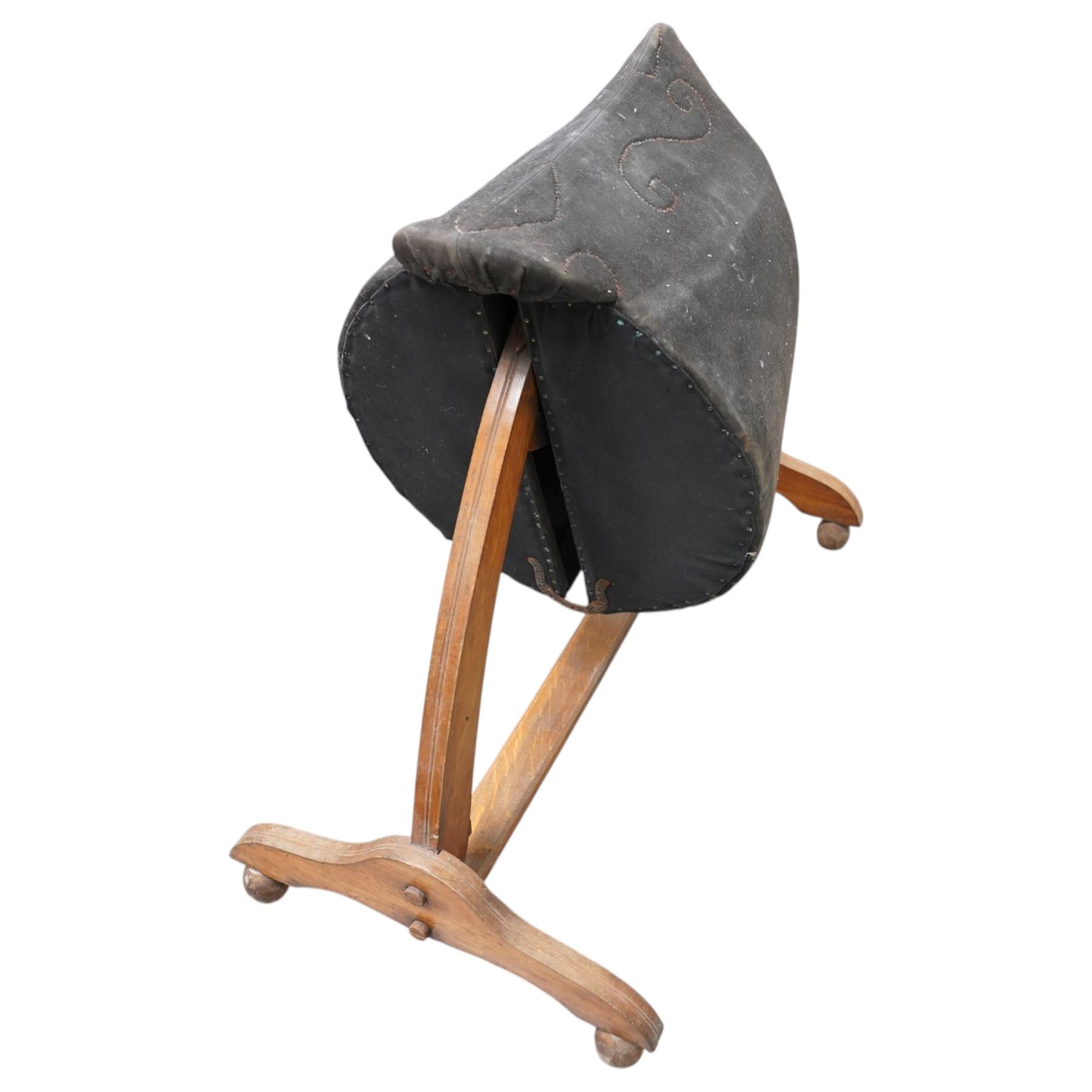 Carlton's - early 20th century weight bearing saddle stand, the top part allowing for the movement of the saddle, on curved oak trestle, marked Carlton's Registered