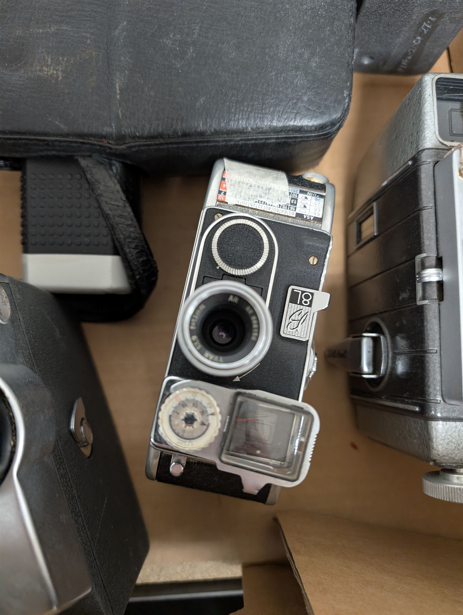 Collection of vintage cine cameras, including Bolex Paillard B8L, Mansfield Holiday Meter Matic, Quarz, Bell & Howell Autoset, Sankyo Super Micro, Canon Demi C, Agfa Movexoom, etc