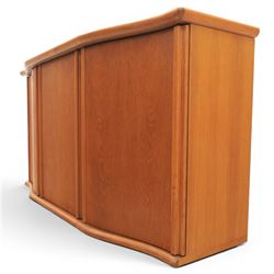 Skovby - model '400T' teak sideboard, shaped top above three cupboard doors with recessed handles, fitted with shelving and drawers