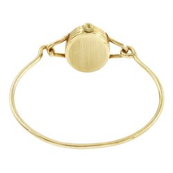 Roy King ladies 9ct gold manual wind wristwatch, black oval dial, on 9ct gold bangle, London 1978