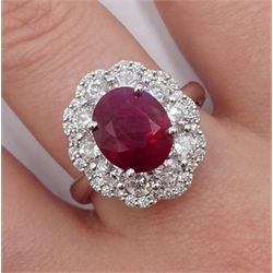 18ct white gold oval ruby and round brilliant cut diamond cluster ring, stamped 750, ruby 3.94 carat, total diamond weight 1.56 carat, with certificate