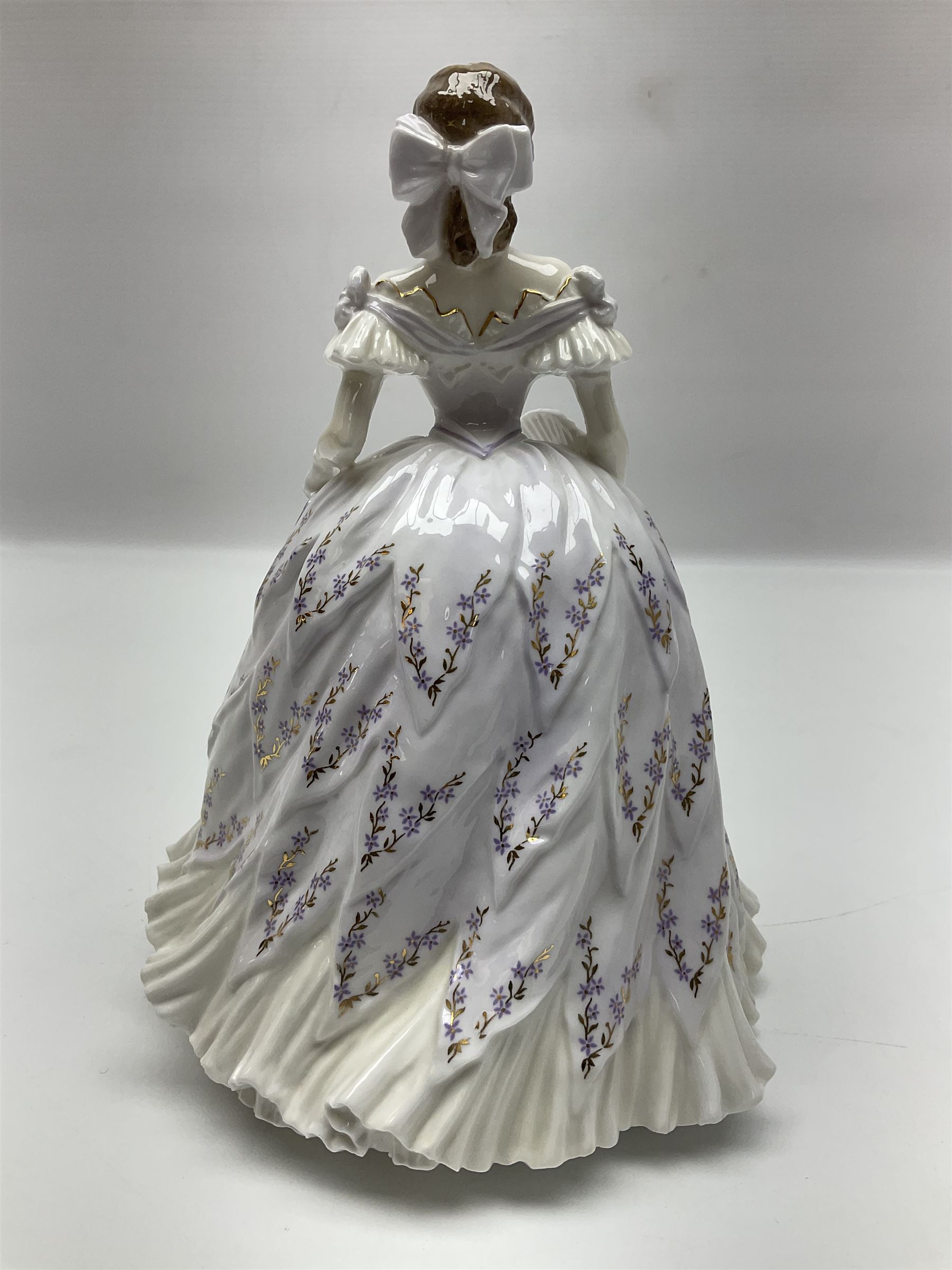 Three Coalport figures, comprising Eugenie, Lillie Langtry and Laura, together with seven other similar figures