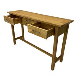 Solid light oak console table, fitted with four drawers