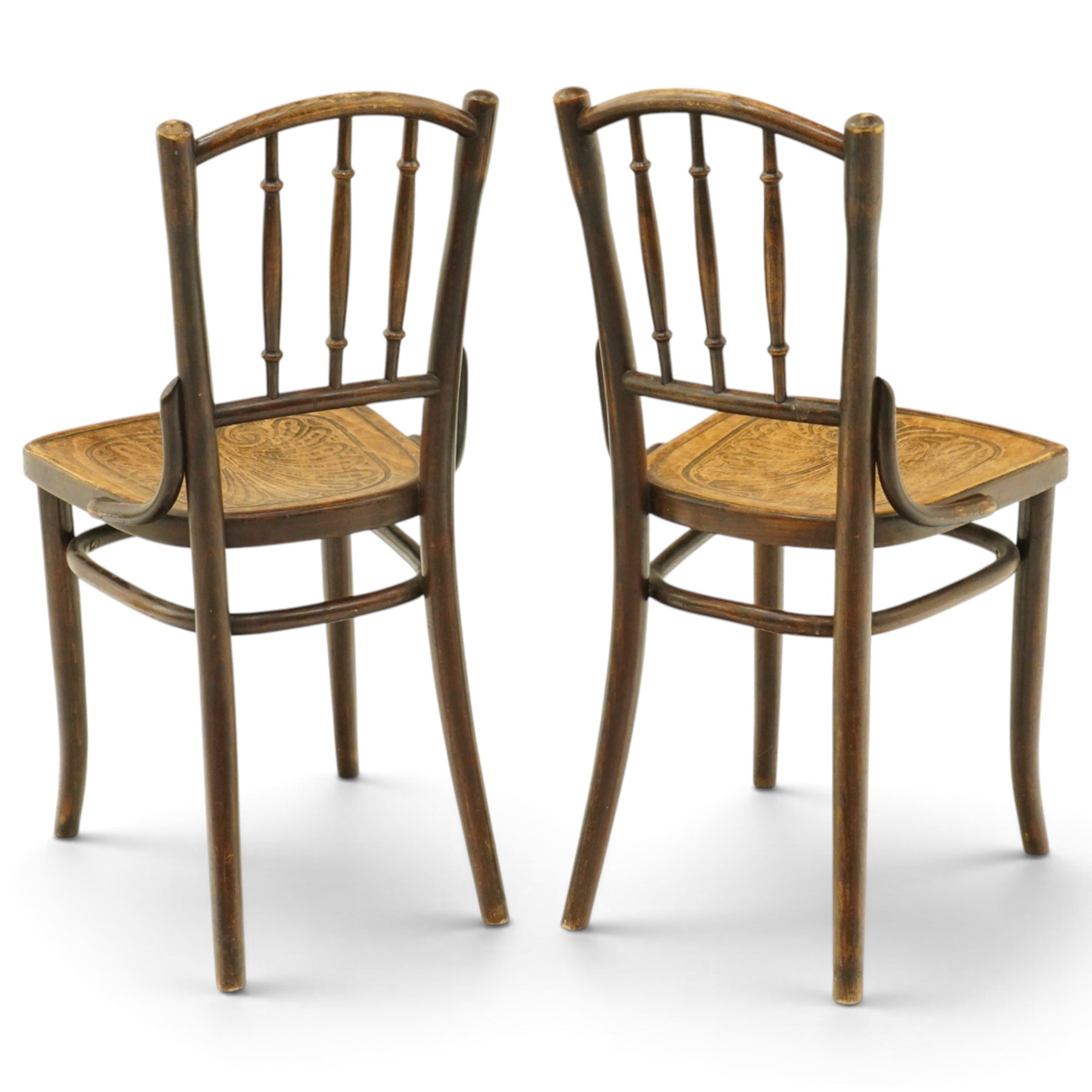 Thonet - pair of early 20th century bentwood bistro side chairs, spindle backs over anthemion motif seats, on tapering supports