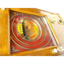  1930's 'Playball' amusement pinball coin repeat wall machine, in oak case, Patent no. 438 597, H63cm x W46cm x D18cm   