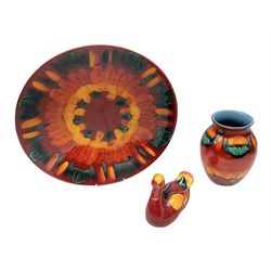 Collection of Poole Pottery, comprising charger and vase in Volcano pattern and a duck figure in a similar pattern 