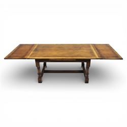 Titchmarsh & Goodwin - stained oak draw leaf dining table, raised on turned supports with H-stretcher, extends to 273cm