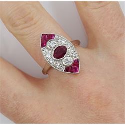 Platinum ruby and diamond marquise shaped ring, the central oval ruby, with round brilliant cut diamond surround and further calibre cut rubies set to each end