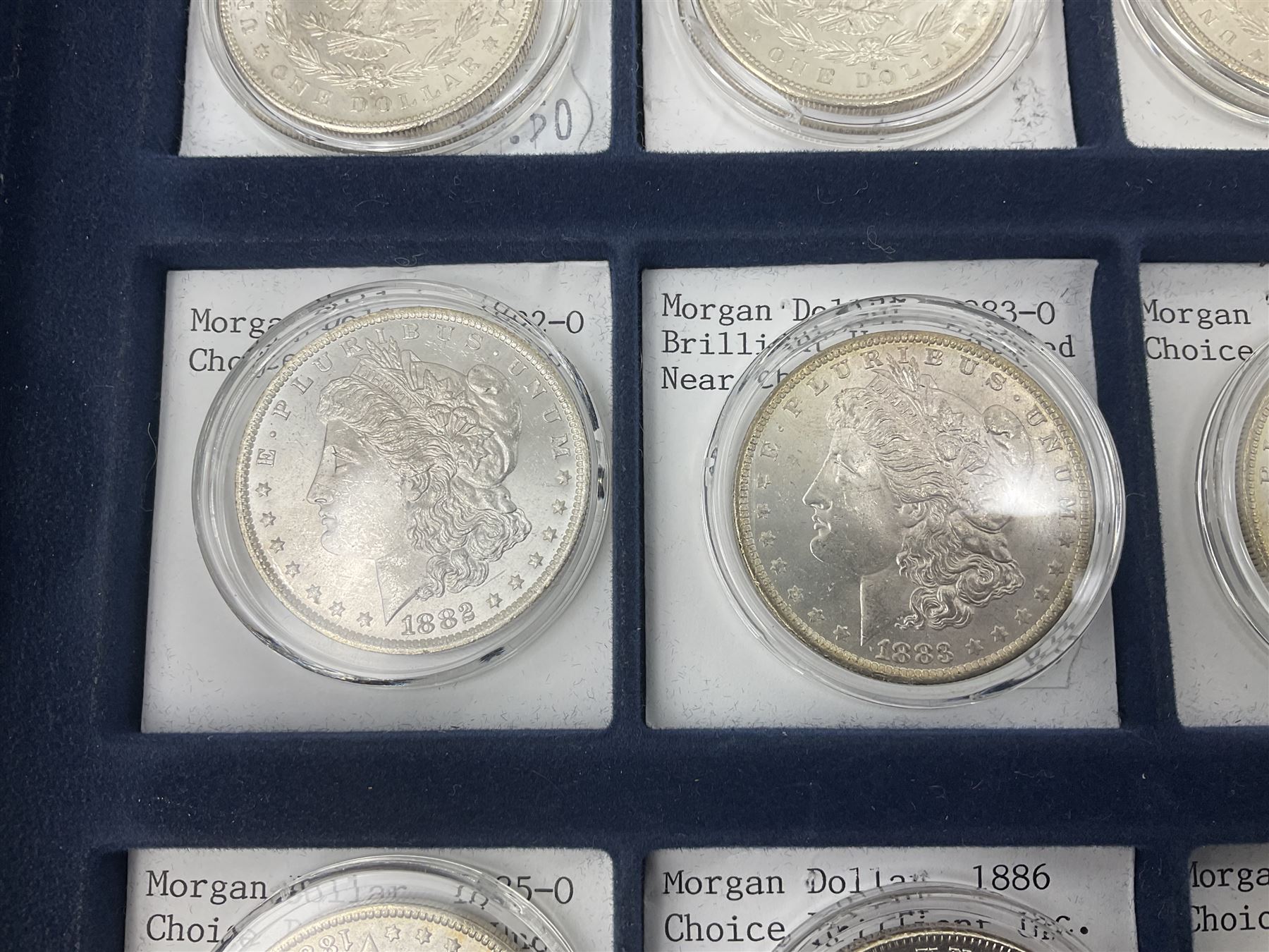 Twelve United States of America silver Morgan dollar coins, dated 1878 S, 1879 S, 1880 S, 1881 S, 1882 O, 1883 O, 1884 O, 1884 CC, 1885 O, 1886, 1887 and 1888