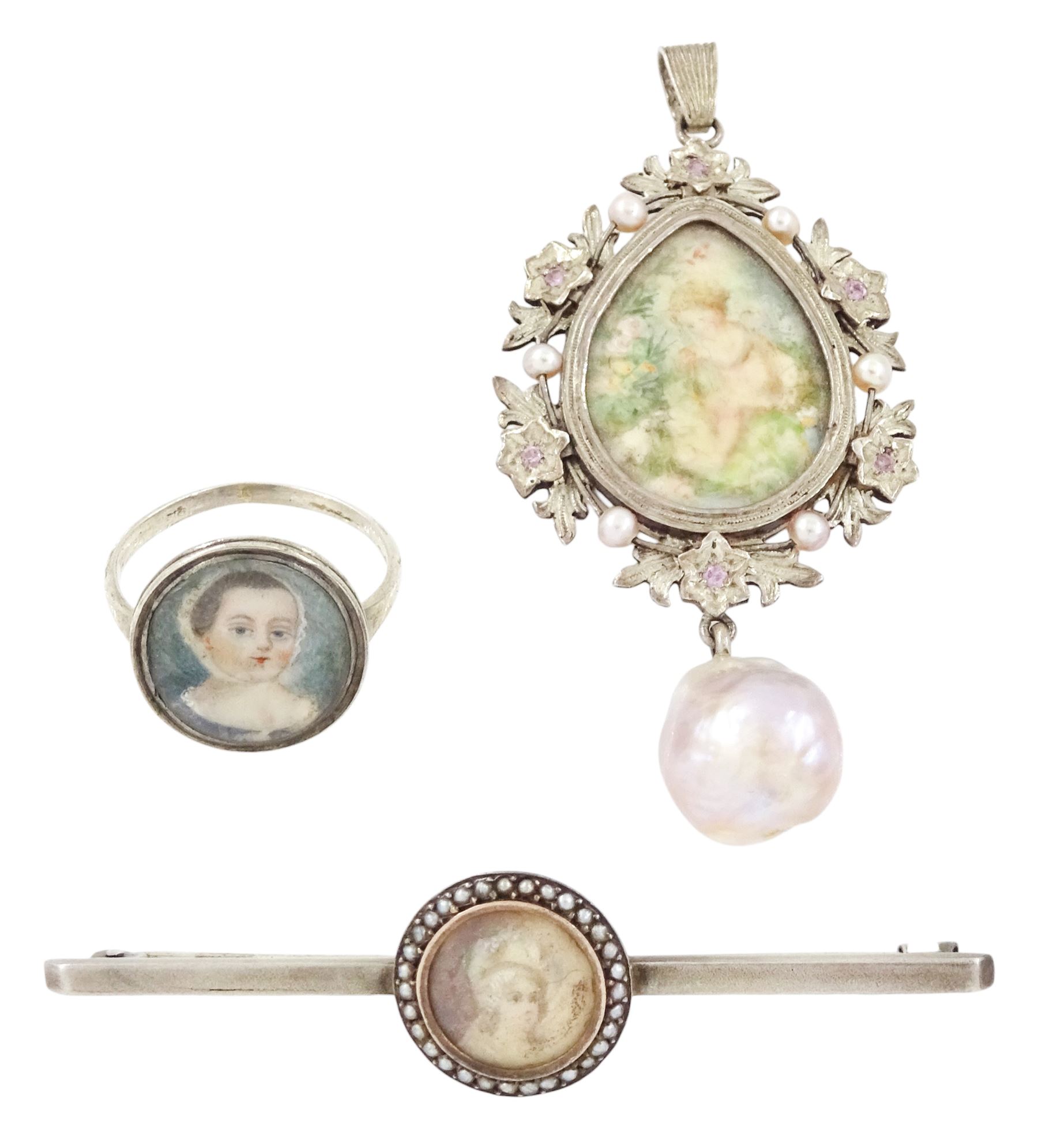 19th/ early 20th century silver portrait miniature jewellery including a pearl set pendant painted with a cherub, a ring painted with a young girl wearing a bonnet and brooch with seed pearl surround, all on ivory. This lot has been registered for sale under Section 10 of the APHA Ivory Act