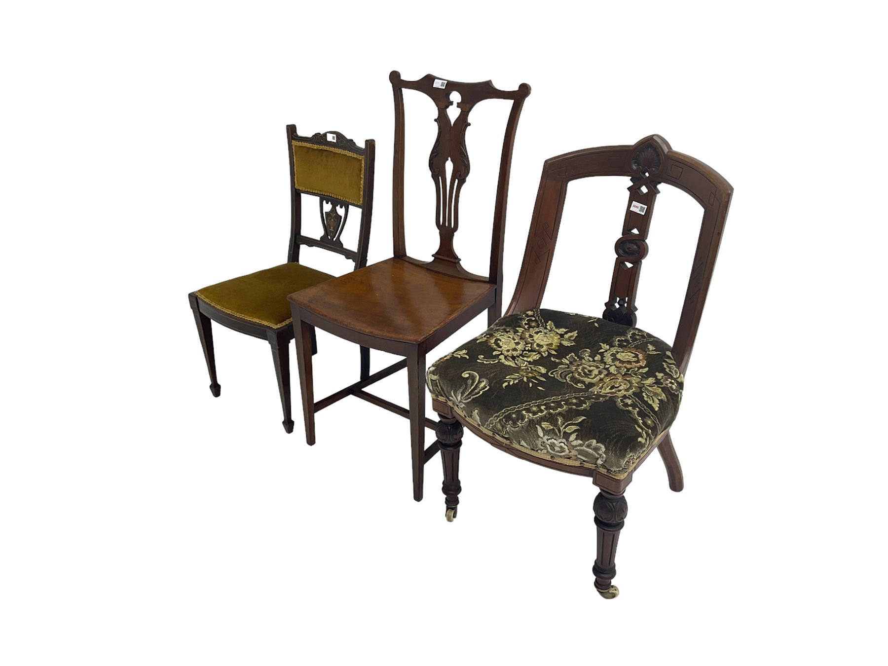 Late 19th mahogany nursing chair, cresting rail with carved cartouche, central splat pierced and carved with flowerhead and geometric design, upholstered seat, raised on turned and fluted tapering supports with brass and ceramic castors; George III Chippendale-style mahogany dining chair, shaped cresting rail with pierced and scrolled slat back; small Edwardian inlaid mahogany bedroom chair, pierced and inlaid urn design, upholstered seat and back (3)