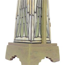 Tiffany style table lamp, the tapering stem and stepped pyramid shade, with naturalistic green foliate decoration on a cream ground, including shade H67cm