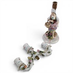 Pair of 19th Century German three-branch figural candlesticks, the figures each in floral dress against a tree, the branches decorated in relief with roses and the sconces painted with insects, H33cm 
