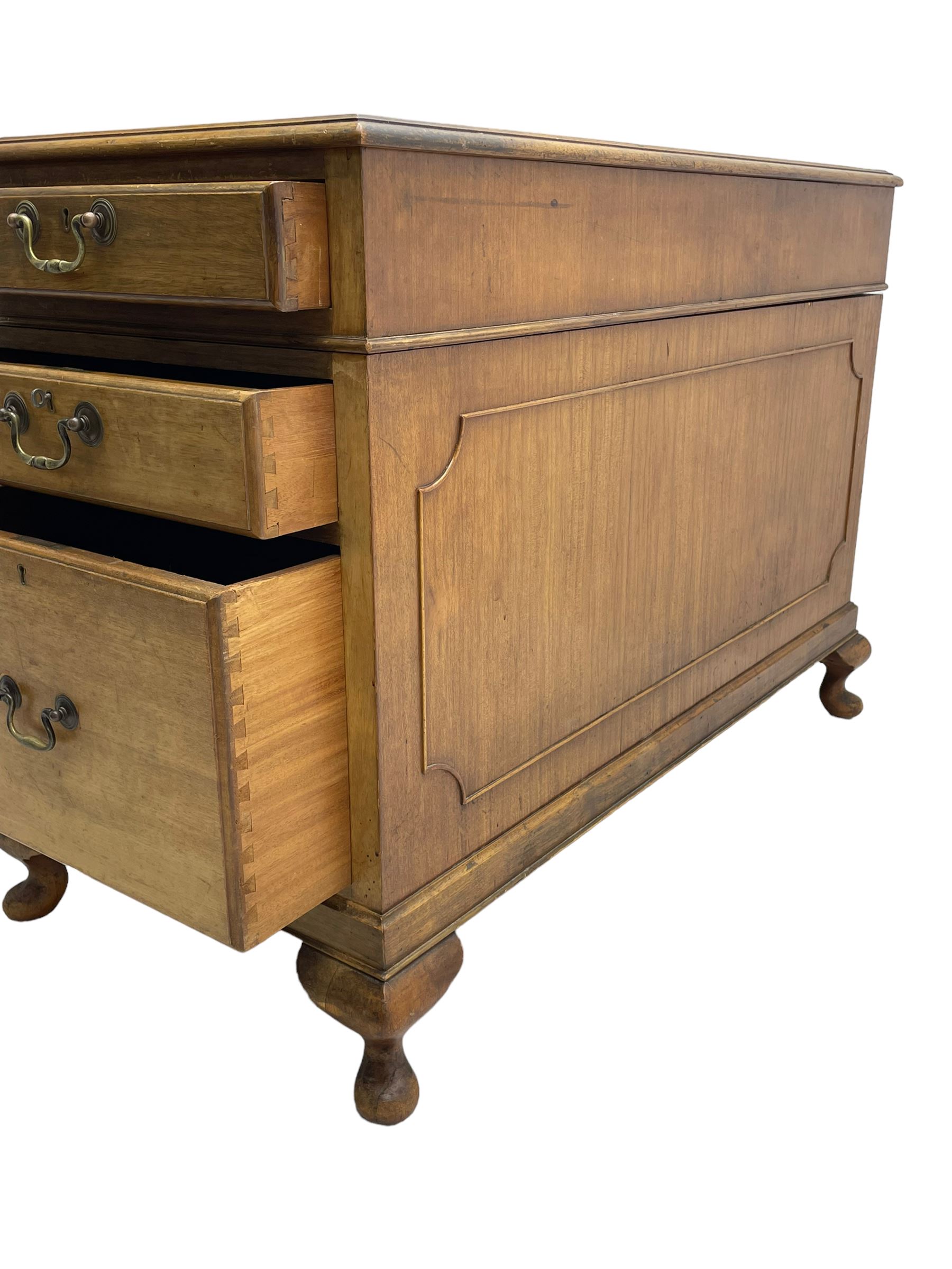 Early 20th century mahogany twin pedestal desk, the moulded rectangular top with three sectional leather insets with gilt decoration, fitted with eight drawers, on cabriole feet