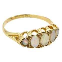 Early 20th century 18ct gold graduating opal ring, hallmarked