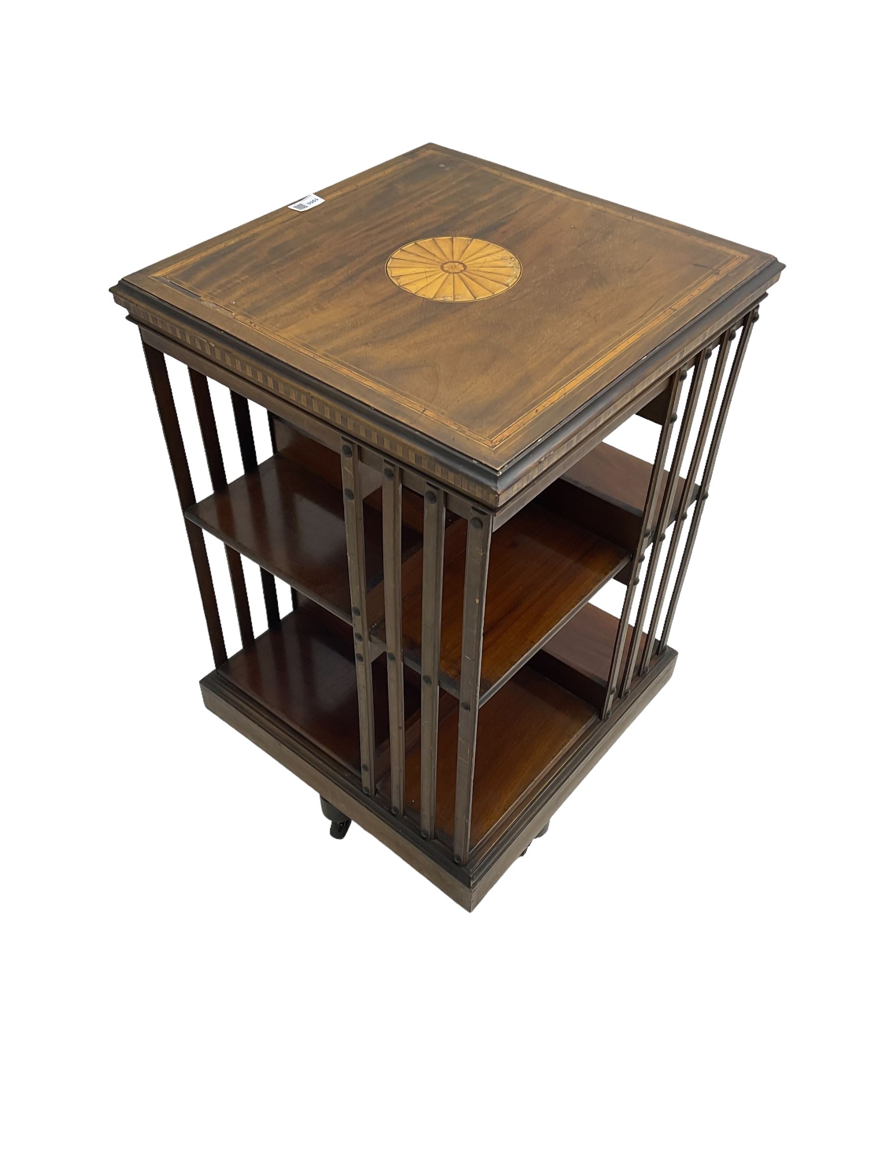 Maple & Co. London - Edwardian mahogany inlaid revolving bookcase, moulded square top with inlaid circular fan motif and satinwood banding, with circular label