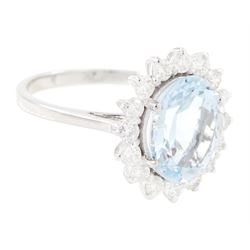 18ct white gold aquamarine and diamond cluster ring, single oval cut aquamarine of approx 2.25 carat, surrounded by sixteen round brilliant cut diamonds, stamped 18K, total diamond weight approx 0.50 carat