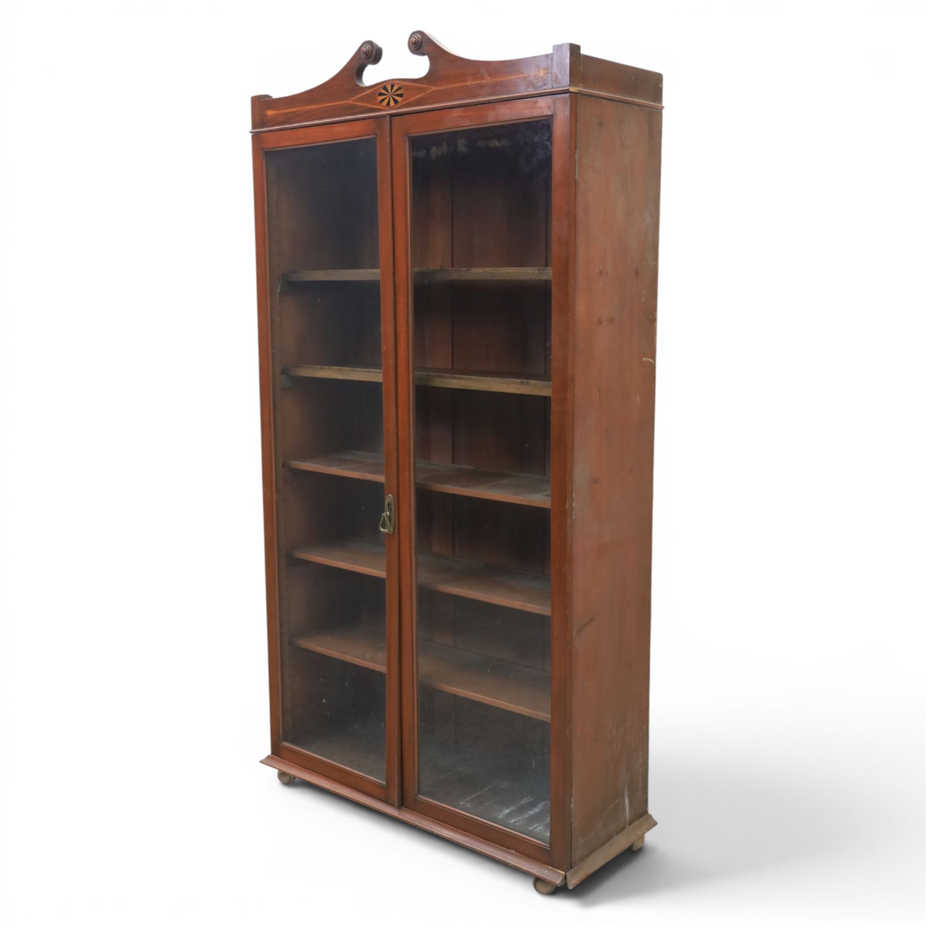 Edwardian walnut bookcase, fitted with two full height glazed doors, inlaid detail with checkered motif, adjustable shelves