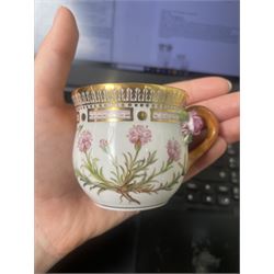 Royal Copenhagen Flora Danica wares, comprising covered mustard pot with naturalistically modelled vine handles and decorated with Cushion Pink (Cucubalius Acaulis) H8cm, milk jug decorated with Maiden Pink (Dianthus Deltoides) H7cm, covered dish decorated with Dwarf Milkwort (Polygala Amarum) W8cm, oval salt cellar decorated with Alpine Squill (Scilla Bifolia) W11cm, egg cup, pin dish and cased hand mirror, various Latin specimen inscriptions to base, all with printed and painted marks beneath (7)