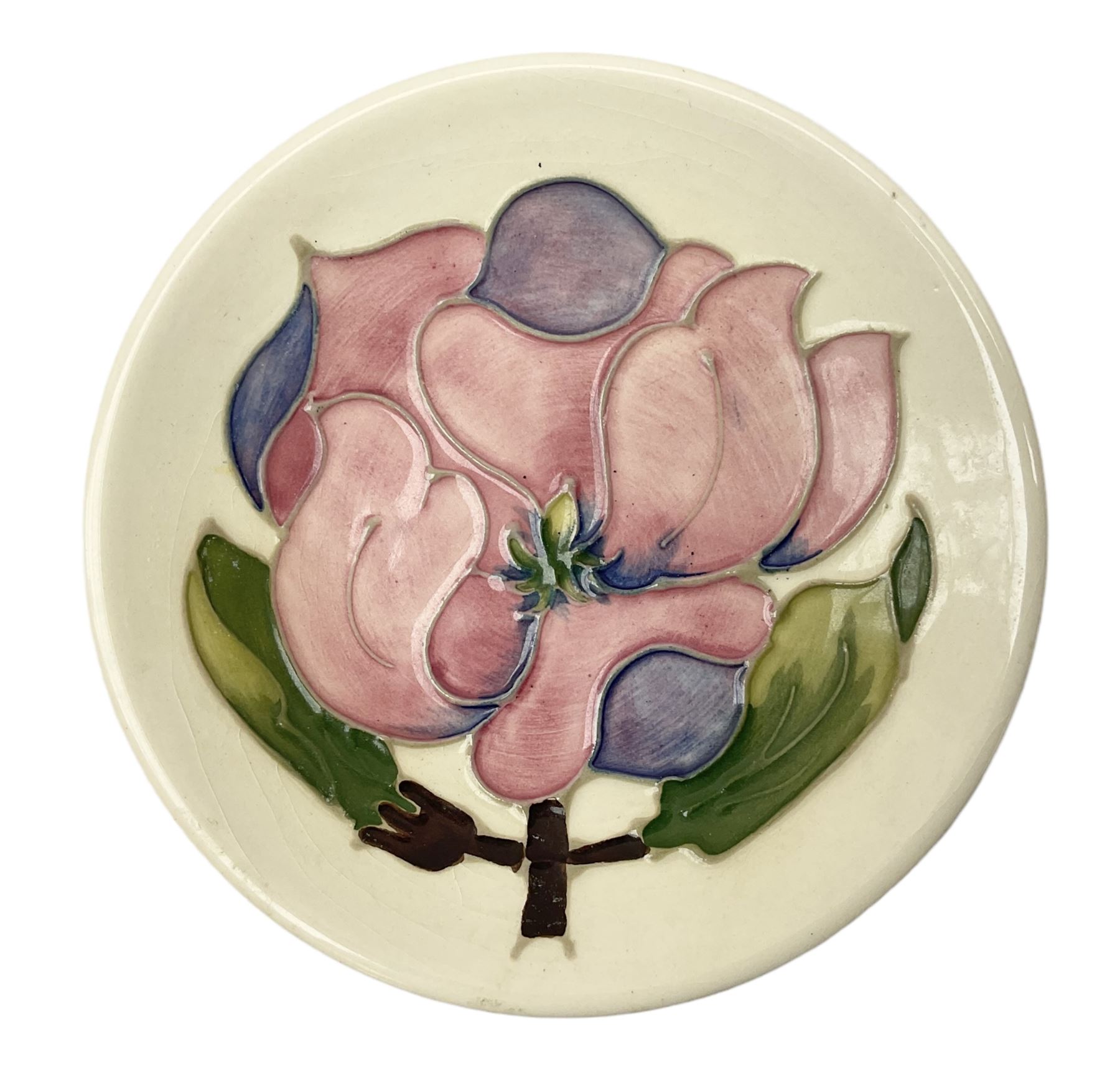 Moorcroft pin dish decorated in the Pink Magnolia pattern on a cream ground, D12cm
