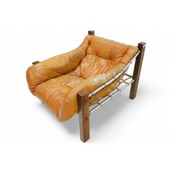 Jean Gillon (Romanian/Brazilian 1919-2007): 'Amazonas' easy chair, mahogany framed with slung leather upholstered cushions, together with matching footstool