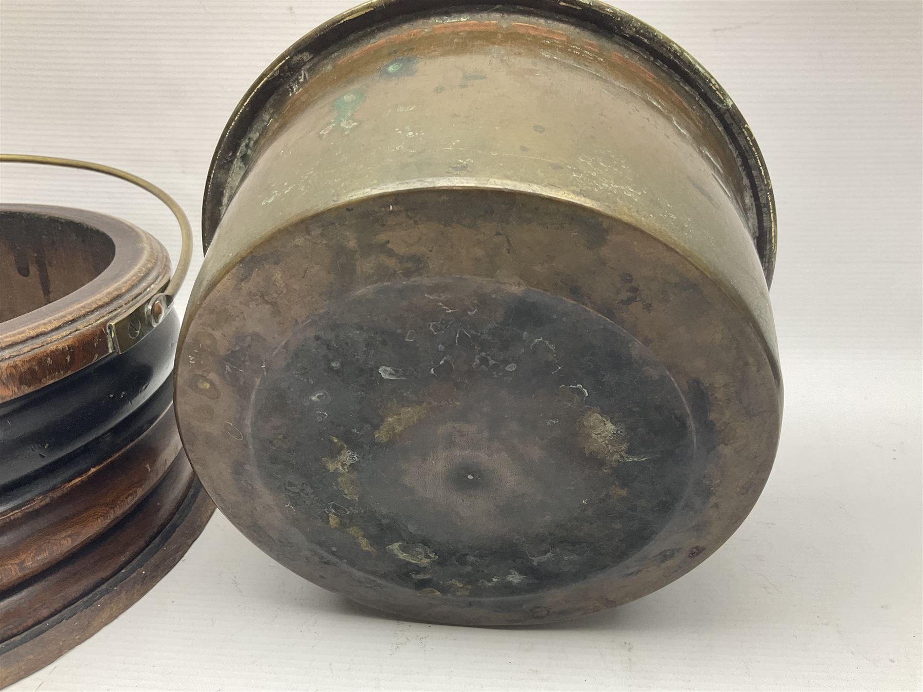  Georgian circular footwarmer with turned wood with decorative ebonised band, brass cover and swing handle, D25cm