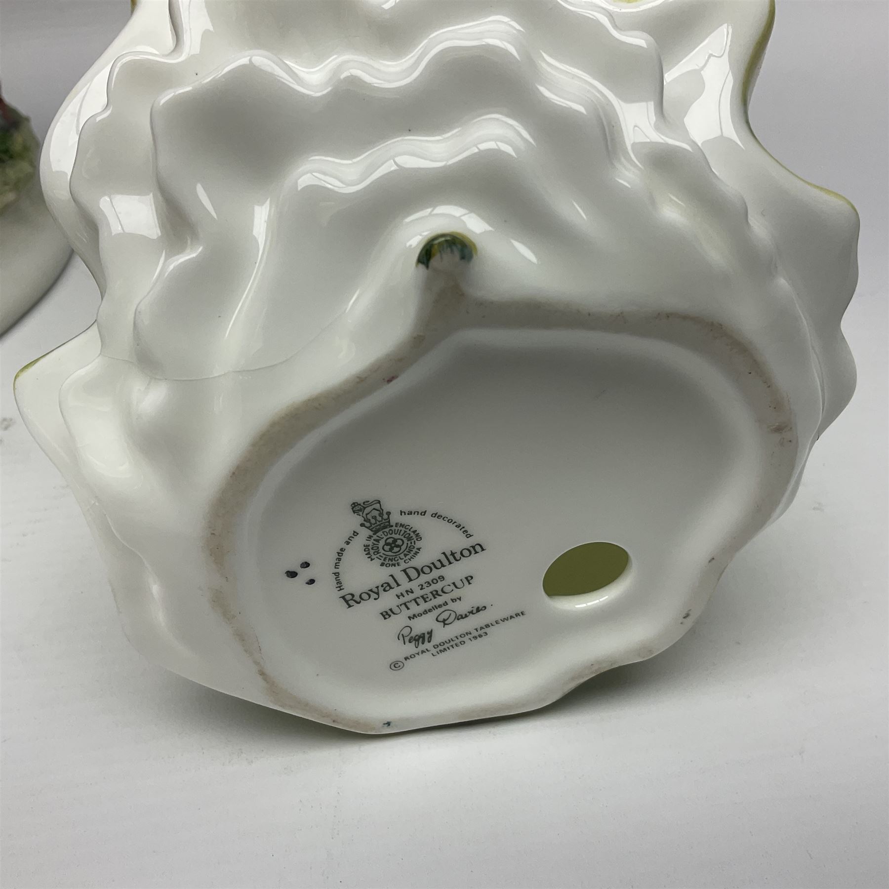 Two Royal Doulton figures, Buttercup HN2309 and Ascot HN2356, together with Capodimonte figure Hussar and His Lady 