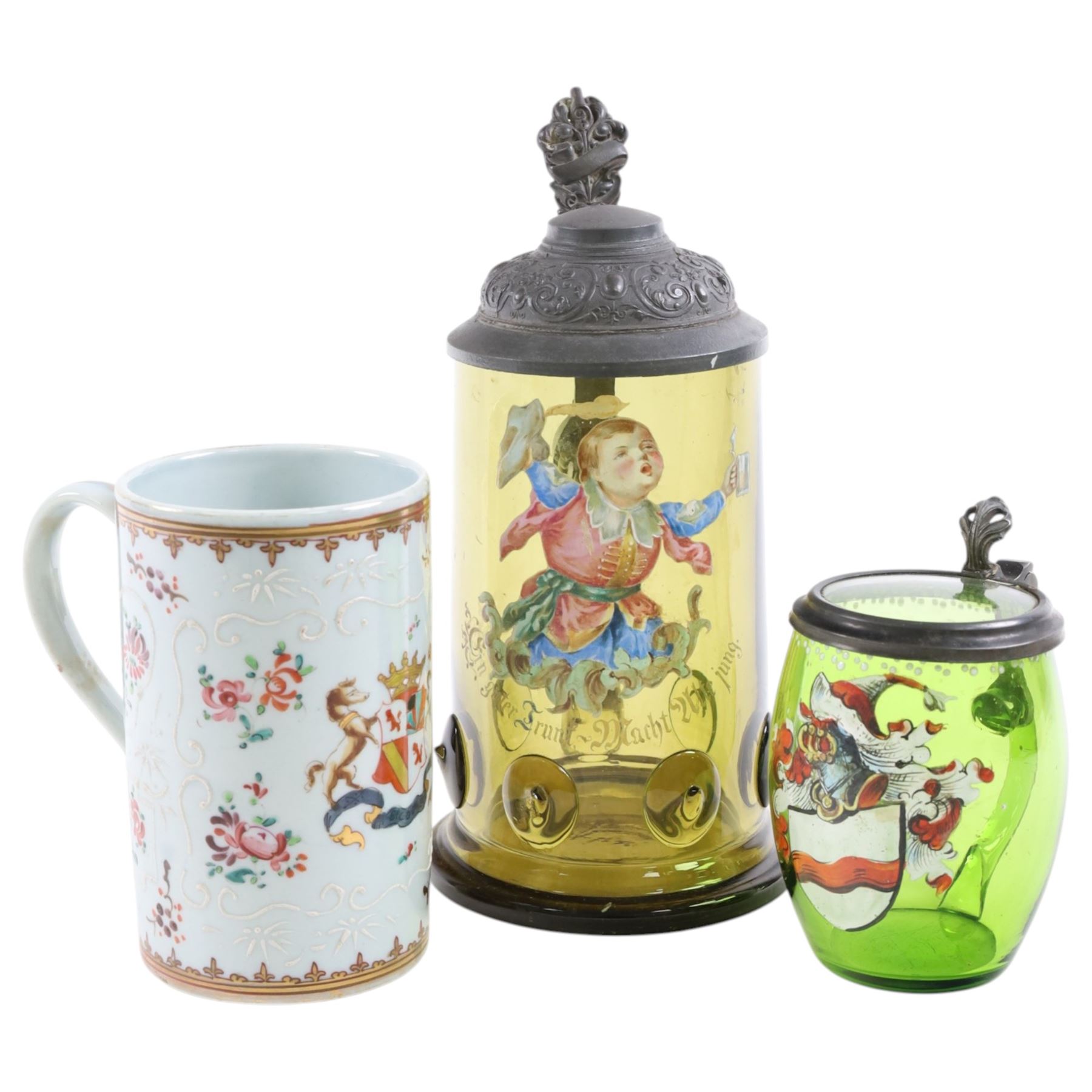 19th century German green glass stein, enamel decorated with a gentleman holding a stein, with a pewter lid, together with another smaller example decorated with a coat of arms and a Sampson style tankard