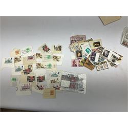 Stamps including Queen Elizabeth II presentation packs, stamps on paper and an album containing world stamps including Canada, Ceylon, Jamaica, Poland etc