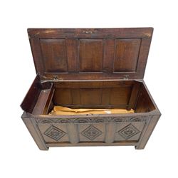 18th century oak coffer or chest, rectangular triple panelled hinged top with moulded edge enclosing main compartment and candle box, the frieze carved with repeating concentric lunettes and foliate patterns, the front fielded panels decorated with lozenges containing central flower heads, on stile supports