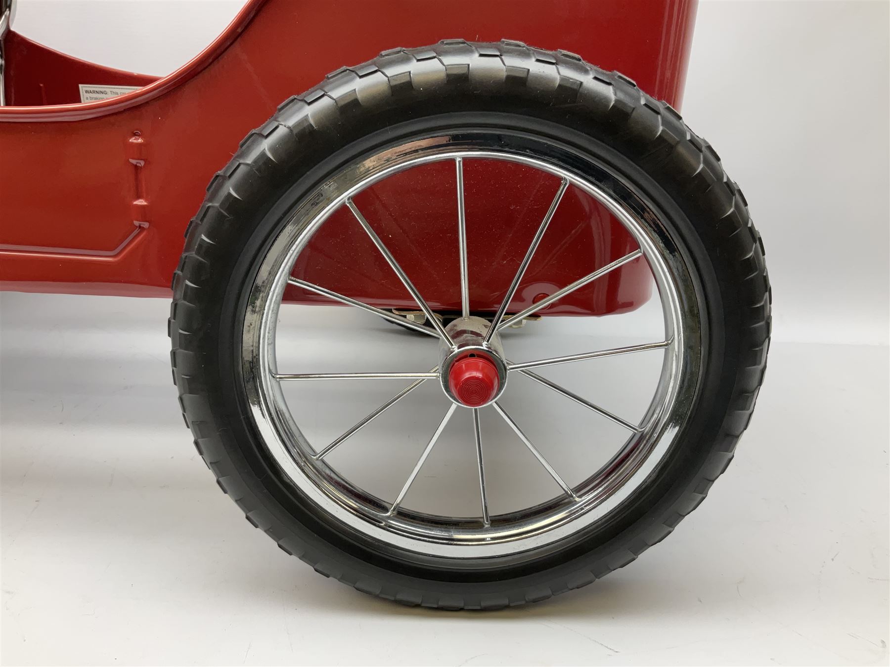 Red child's tin-plate pedal car with chrome detail, by Posh Paddles, Scarborough, H56cm, L80cm