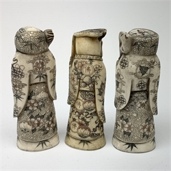 Three 19th century Japanese Meiji bone okimonos, modelled as scholars with staffs, H10cm, (3)  