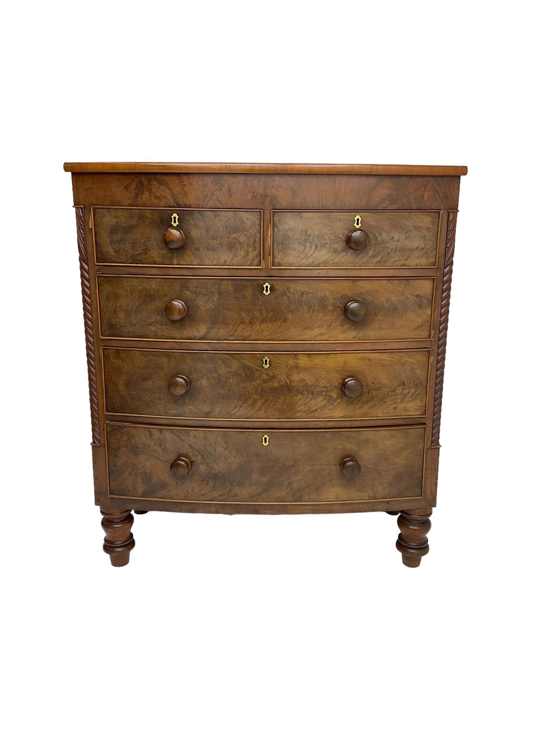 Late 19th century mahogany bow-front chest, fitted with two short drawers over three long drawers each with cockbeaded fronts, raised on turned feet