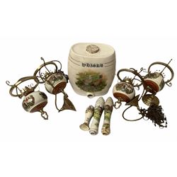 Ceramic hanging light fittings decorated with fox hunting scenes with brass fixtures, ceramic beer pulls decorated with hunting scenes and ceramic whisky barrel decorated with a pheasant