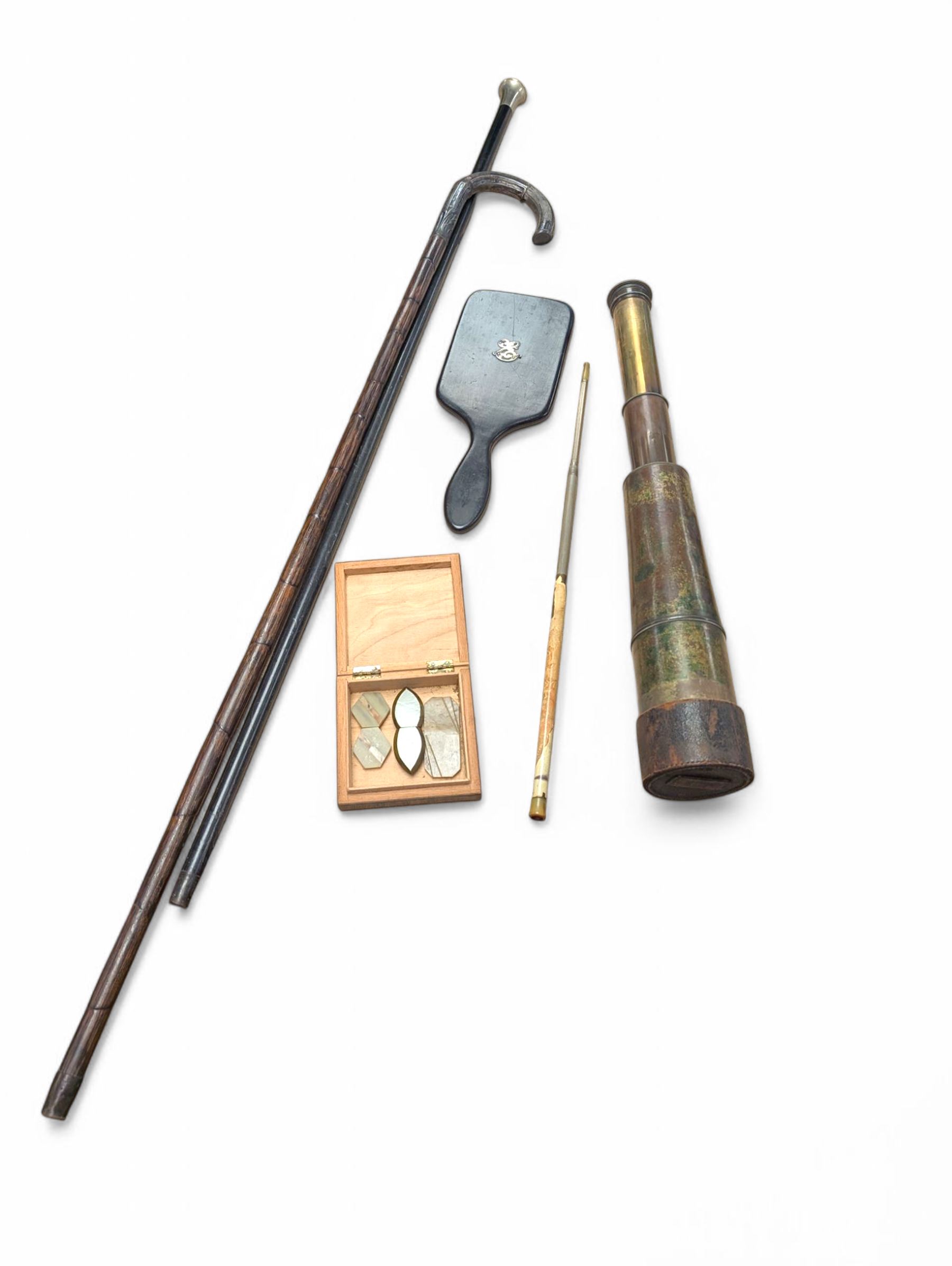 Five draw brass telescope, ebony hand mirror with silver initial, telescopic cheroot holder, buckles and two walking sticks