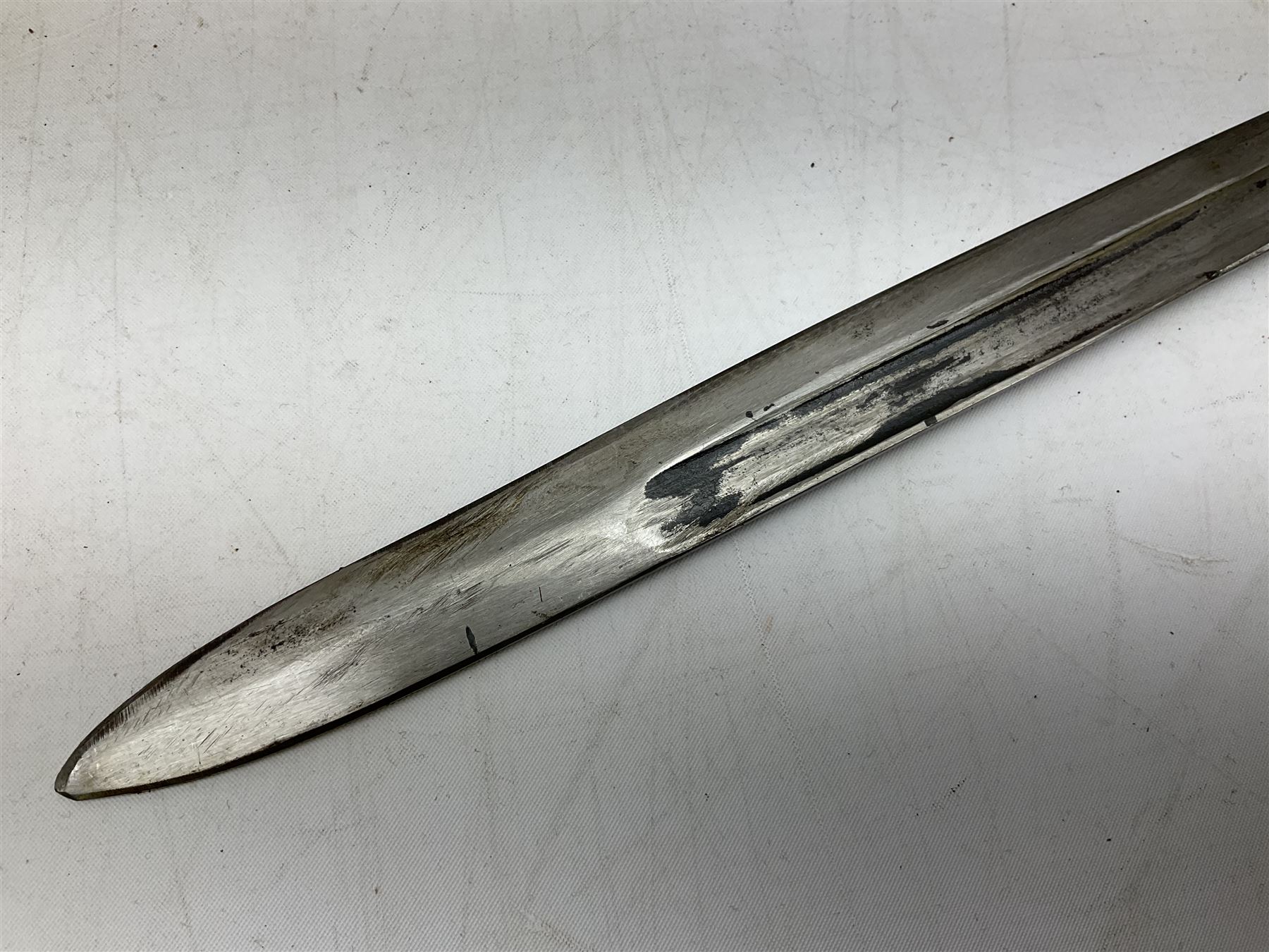 Italian Model 1891 Carcano knife bayonet with 30cm fullered steel blade, the cross-piece stamped VL1110; in steel scabbard with webbing frog L43cm overall; and another Italian fighting knife/bayonet in brass bound leather scabbard (2)